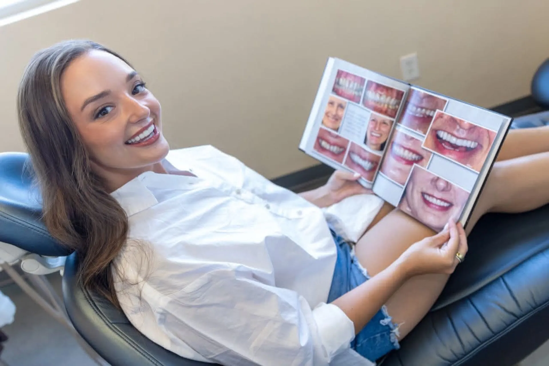 Patient looking at a smile gallery book