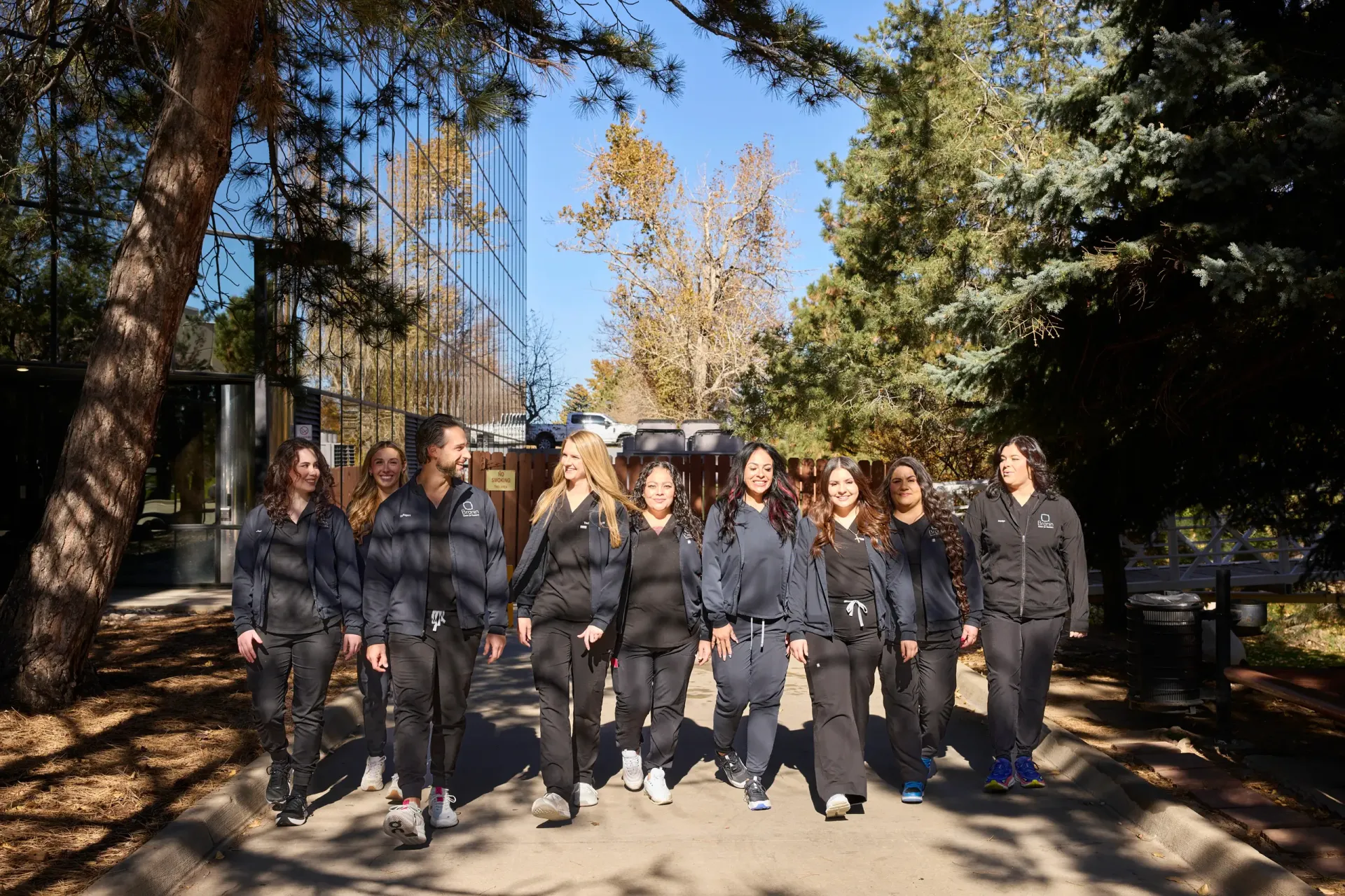 Team members walking down the sidewalk