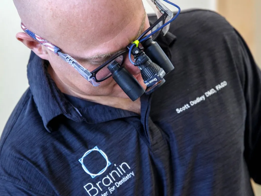 Dr. Dudley examining a patient wearing latest technology