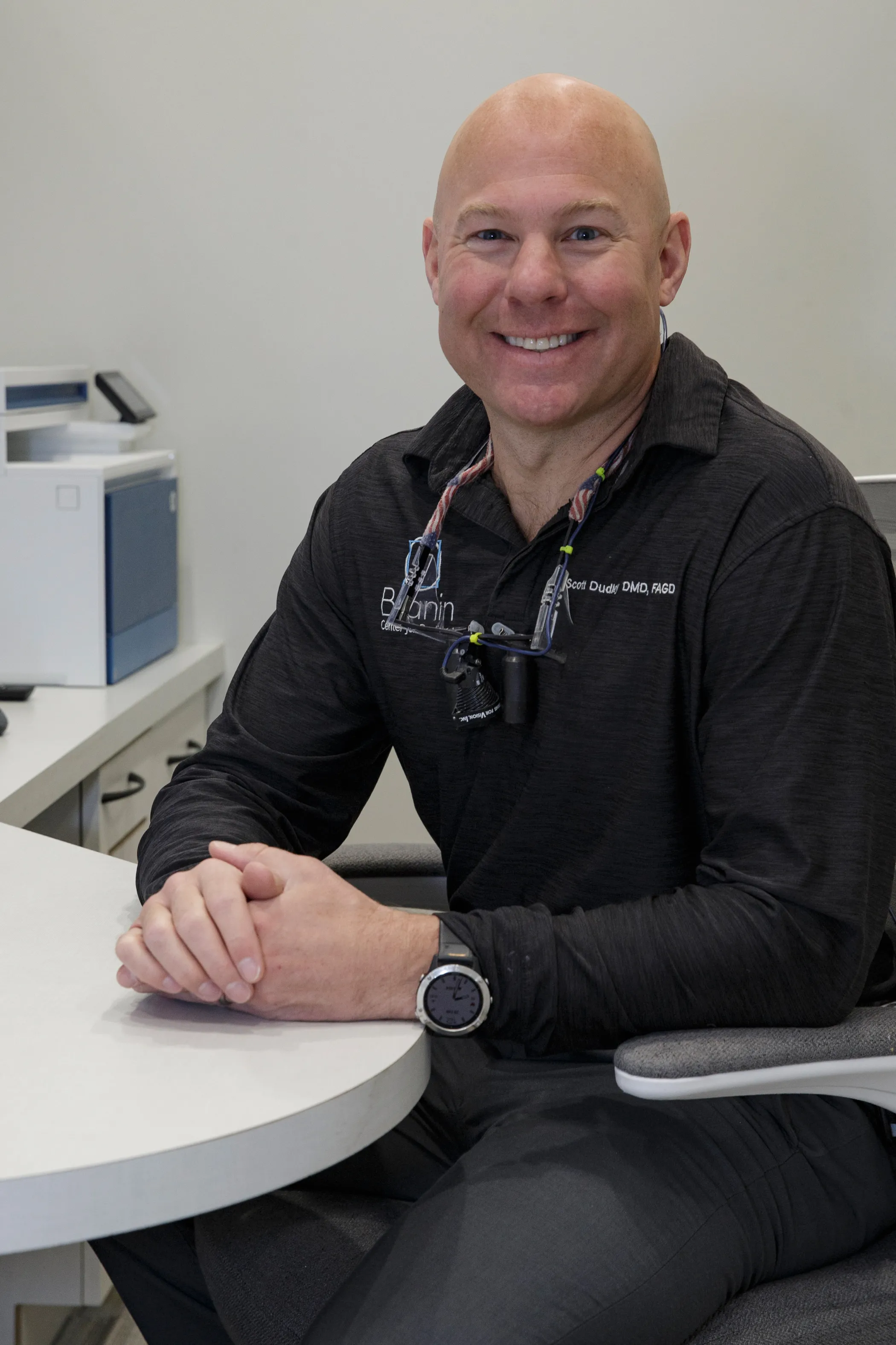 Dr. Dudley smiling.