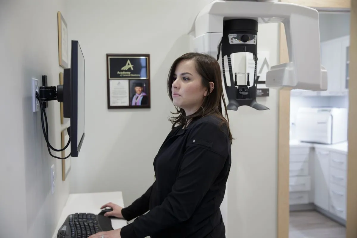 team member at a standing desk