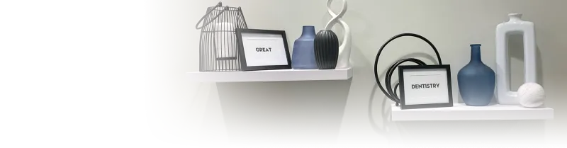 Two shelves with jars and framed photos