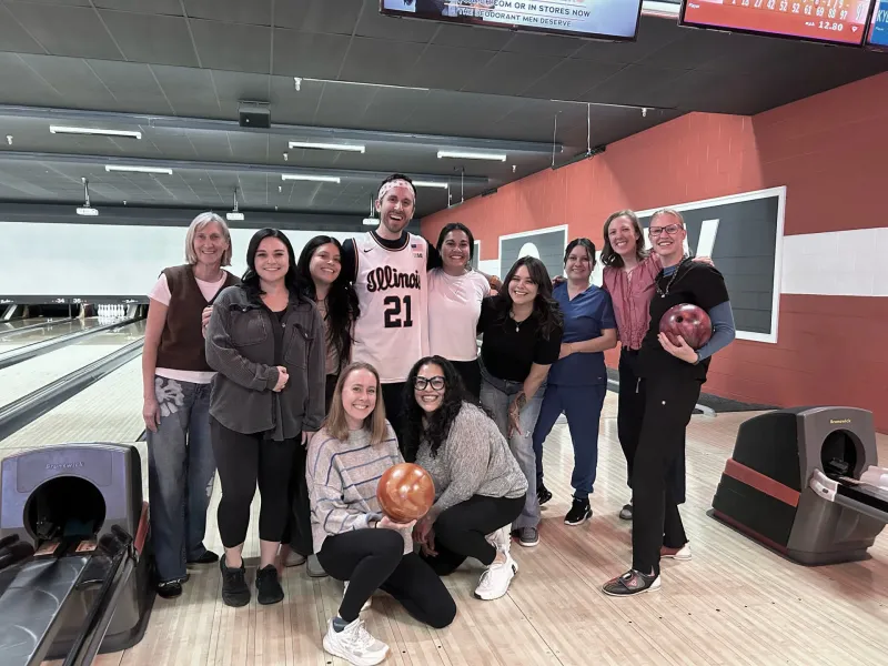 The team at Golden posing on a bowling lane
